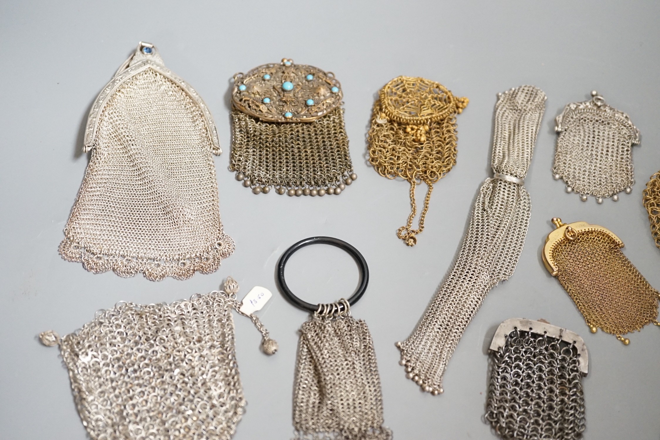 A collection of 19th century multi coloured metal chain mail evening bags and purses (14)